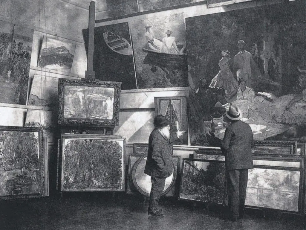 Claude Monet in his second studio in Giverny with the Duc de Trevise, 1920