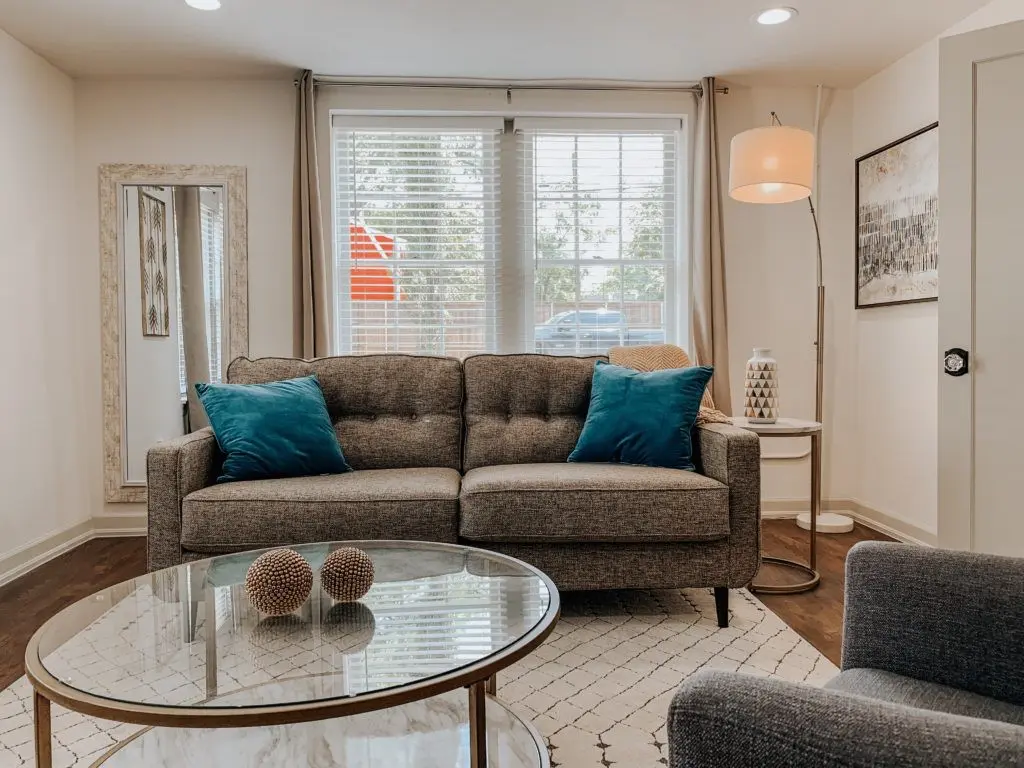 The living area of a one-bedroom unit includes lots of natural light. Photo by Kelsey Littlefield