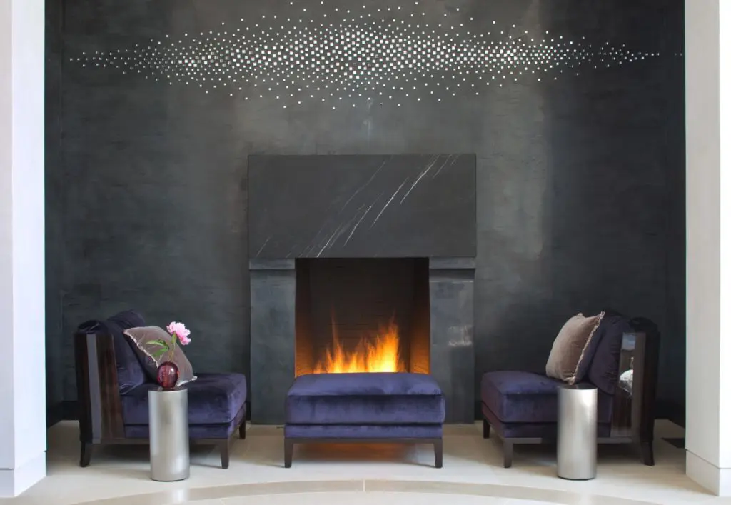 The Michele and Jack Lafield house in Dallas' Old Preston Hollow. Christian Liaigre chairs, ottoman from David Sutherland. Teresita Fernandez's wall sculpture 'Mirage (Horizontal),' 2011. (Photo by Emily Minton Redfield)