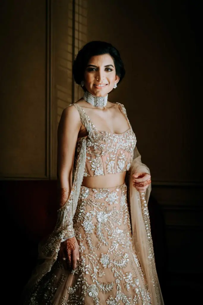 Puja Verma's wedding gown was custom made for the bride in India by couturier Manish Malhotra. (Photo by Philip Thomas)