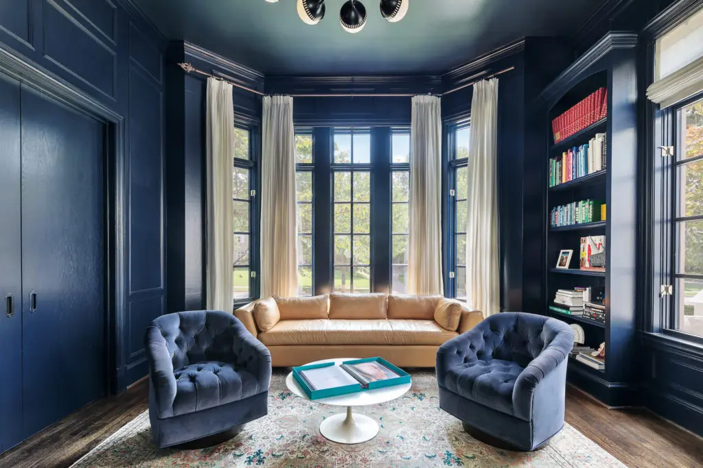 A sophisticated study serves as a retreat from the kitchen. 