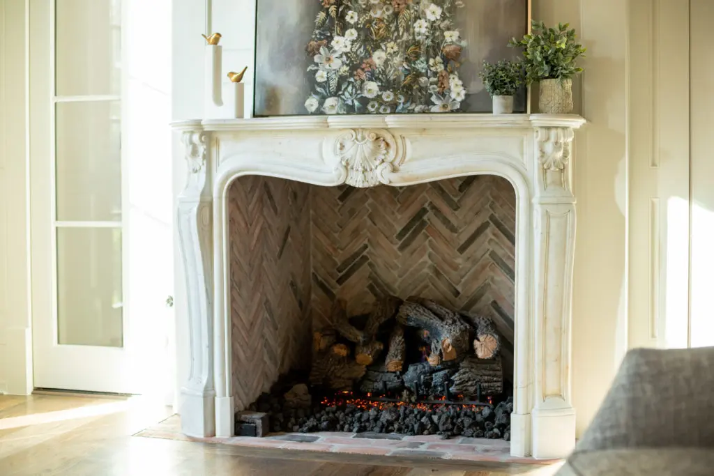 Antique marble mantles wrap the six fireplaces that are scattered throughout the house. (Photo by Savannah Montgomery)