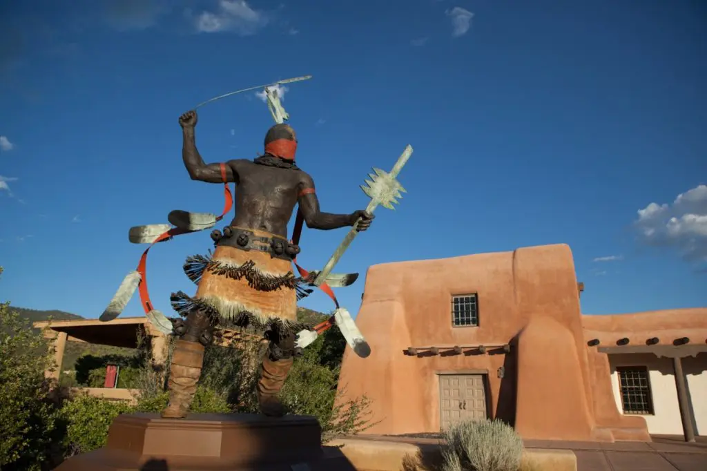 Apache Mountain Spirit Dancer in front of the Museum of Indian Arts & Culture. (Photo by TOURISM Santa Fe)