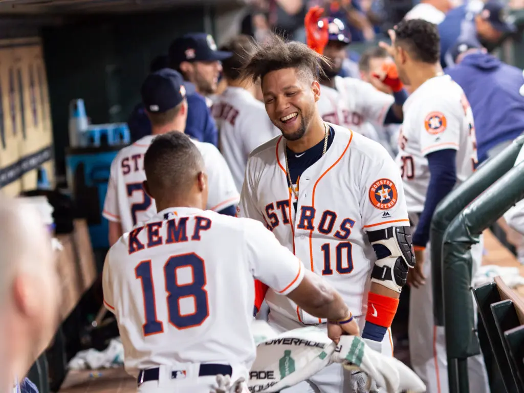 Yuli Gurriel and Tony Kemp enjoy a dugout moment from back in their Astros days. (Photo by F. Carter Smith)