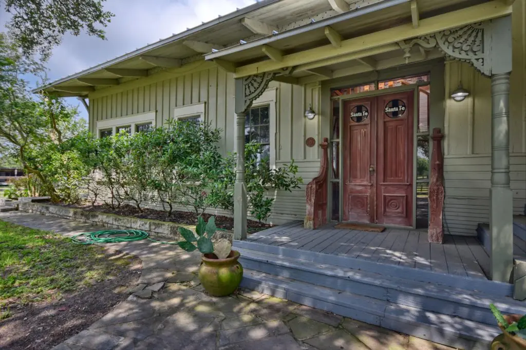 The train depot doors welcome visitors to the DeGuerin ranch house, which is on the market for $1.2 million. (Photo by John Deans, Deans Imaging)