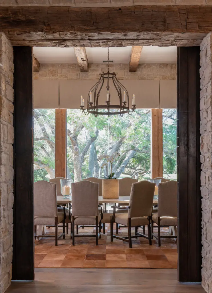 The formal dining room provides a view to the oak-shrouded grounds. (Photo by Michael Hunter)
