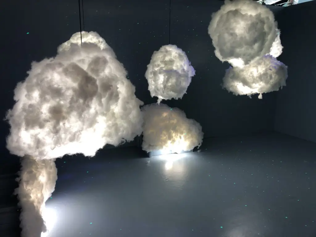 Pose in the clouds at the art installation. (Photo by Megan Ziots)