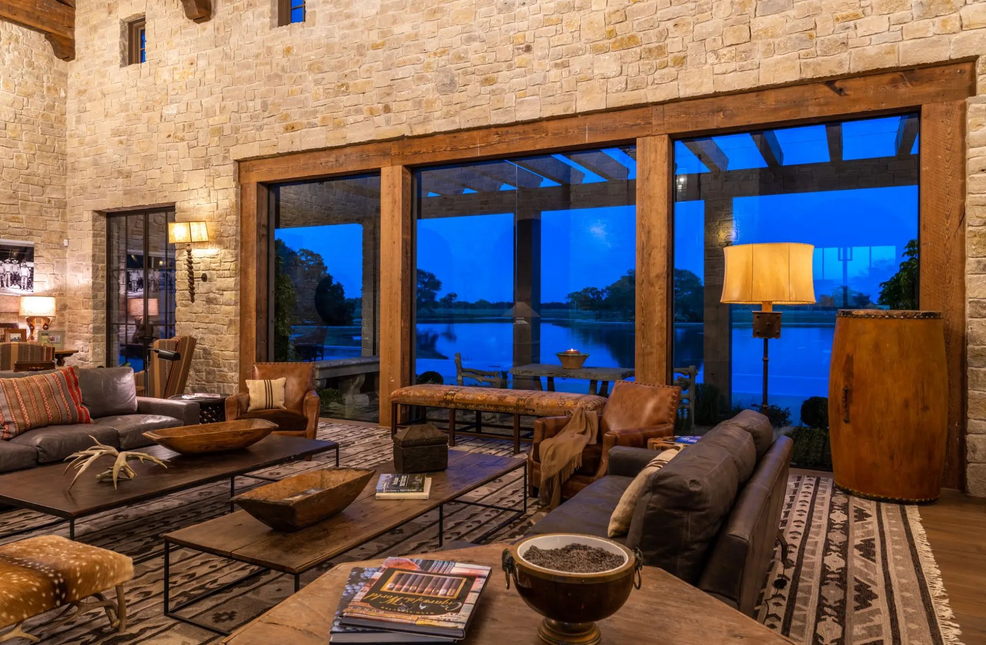 The living room or great room offers views to the five-acre lake. (Photo by Michael Hunter)