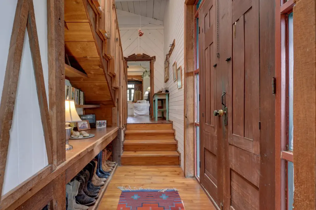 A cowboy boot collection greets guests who arrive through the front door. (Photo by John Deans, Deans Imaging)