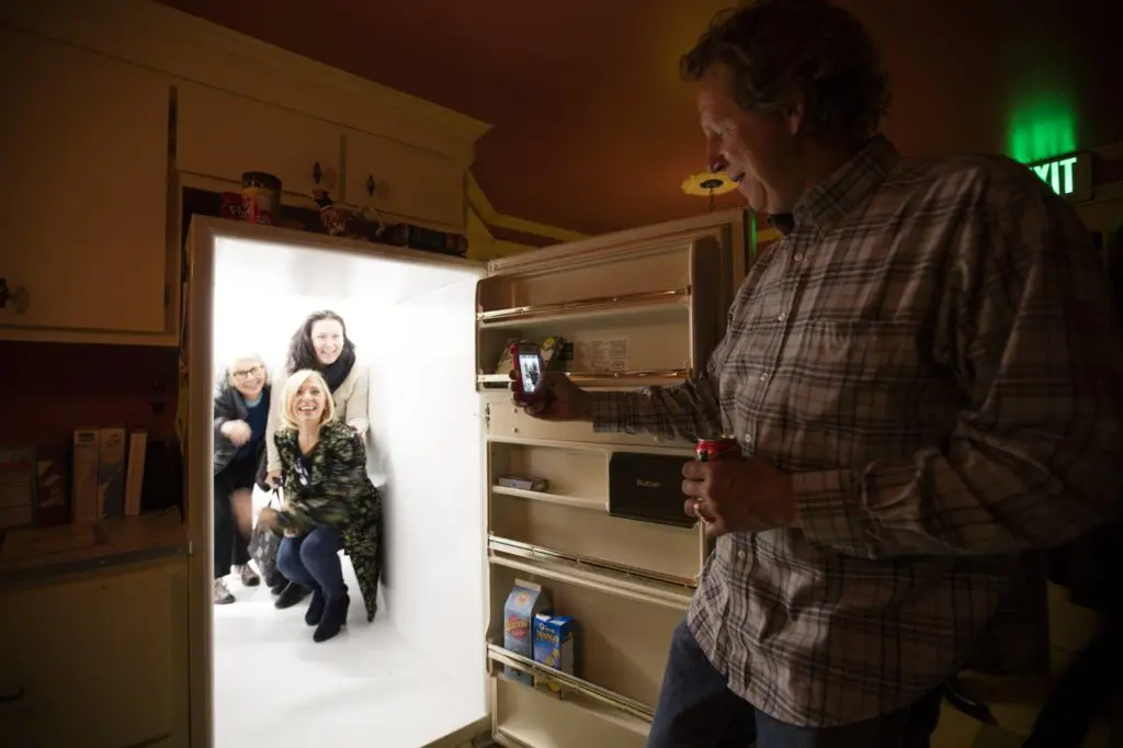 Visitors exploring Meow Wolf can 'disappear' through a refrigerator door. (Photo by Kate Russell, Courtesy of Meow Wolf)