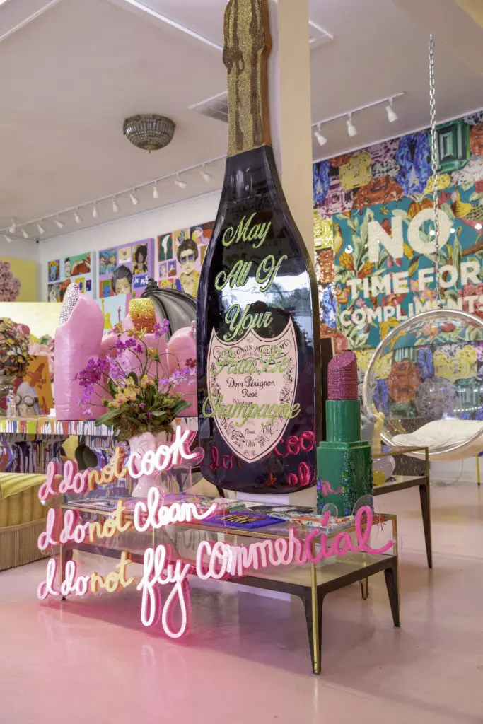 Longshore's bottle of Veuve is her calling card, and here it sits behind a piece that states, "I Do Not Cook, I Do Not Clean, I Do Not Fly Commercial," which is also the name of her upcoming coffee table tome published by Rizzoli.