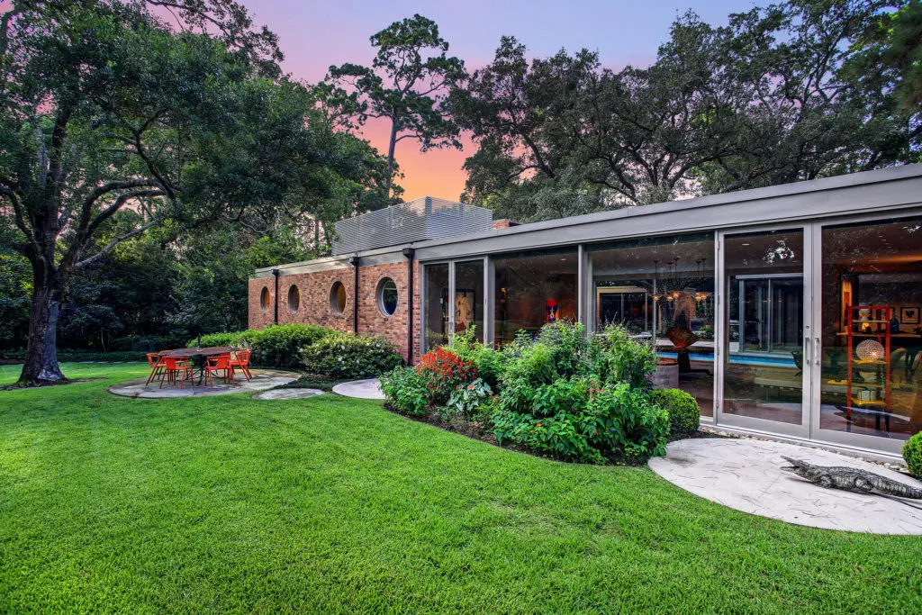 The mid-century masterpiece by Hugo Victor Neuhaus Jr., tucked on Lazy Lane in the heart of River Oaks, is privately on the market for more than $11 million. The sale is being handled by John Daugherty Realtors.  (Photo by TK Images)