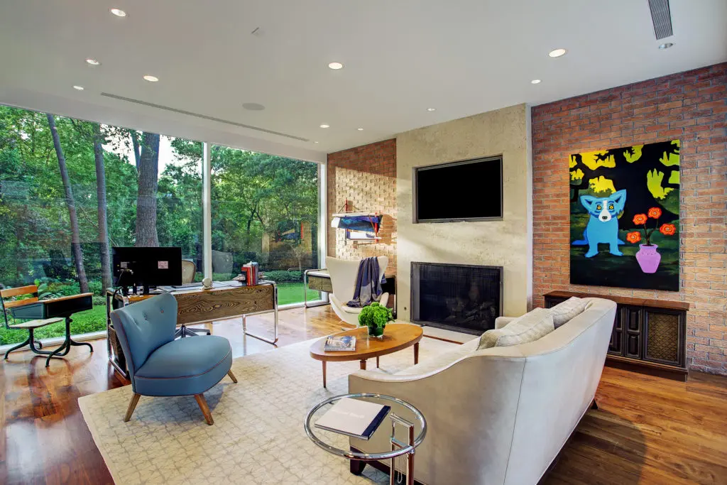 The library reflects mid-century modern characteristics including both glass walls and brick walls. (Photo by TK Images)