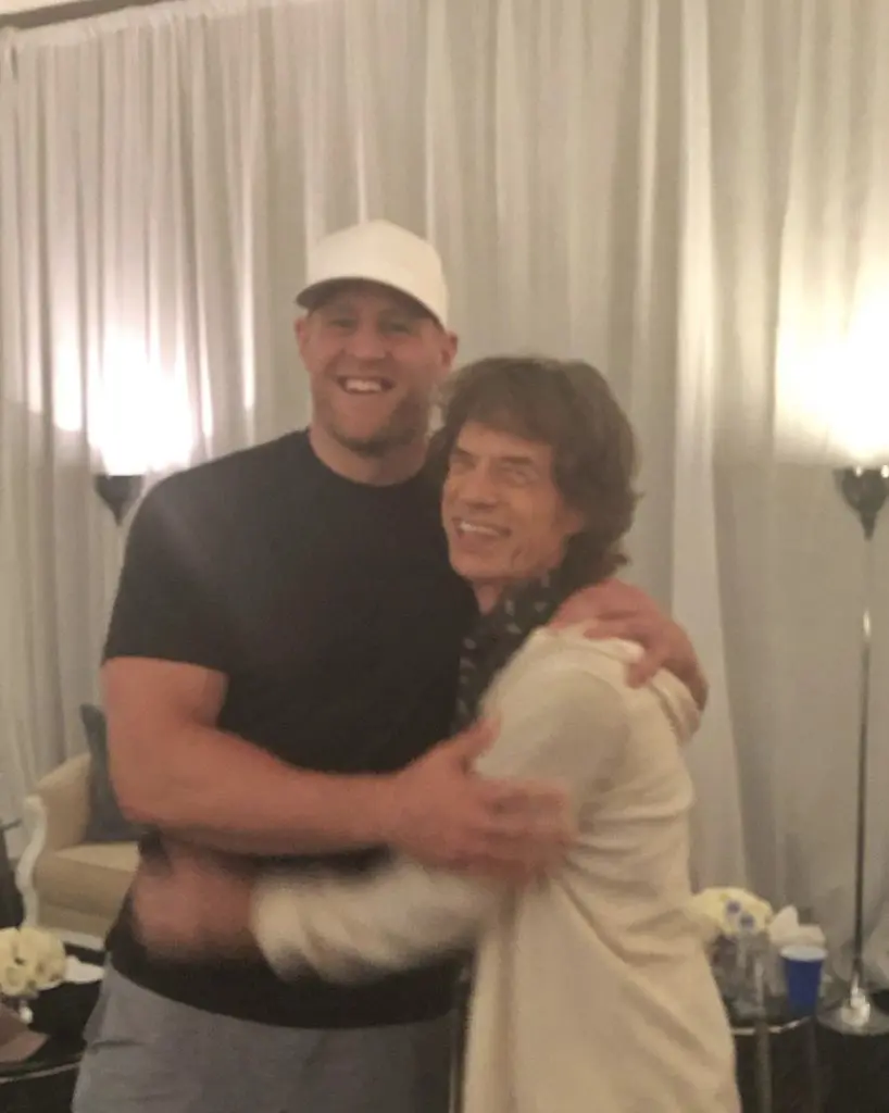 J.J. Watt and Mick Jagger shared a backstage hug at the Rolling Stones' Houston concert. (@jjwatt)