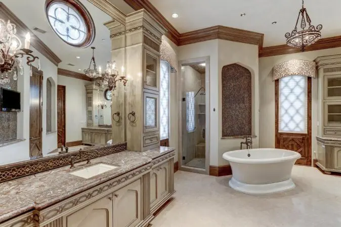 When the design is English Tudor as in this home by Tanglewood Builders, the master bath reflects a more traditional look.
