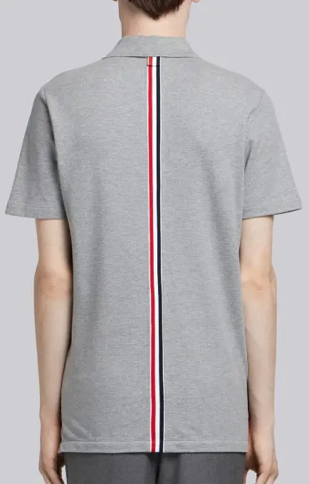 Thom Browne center-back stripe pique polo, available at Thombrowne.com and Traffic LA stores, $470.