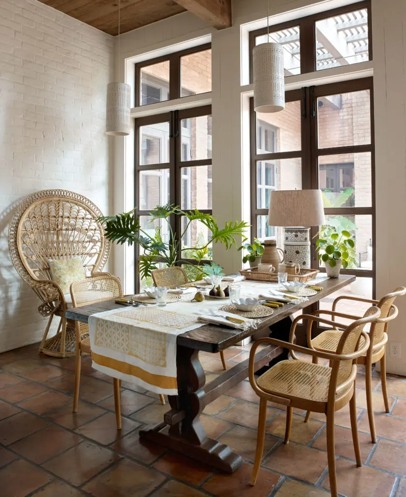 In the breakfast area of the Colburn-designed Houston home, Tom Scheerer painted the original ceramic light fixtures white.  (Photo by Francesco Lagnese)