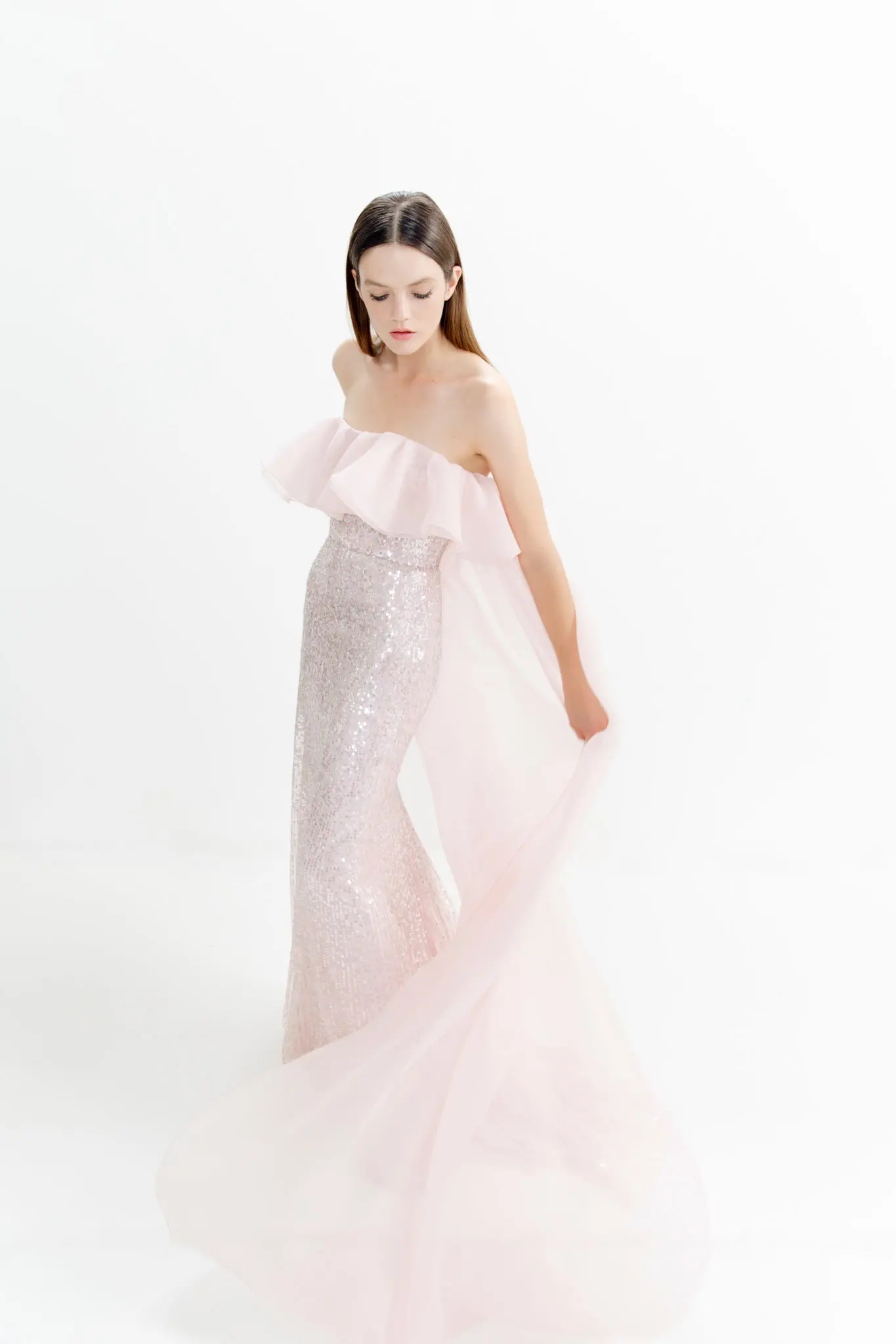 Jenny Packham blush pink sequin strapless gown with organza frill and train. (Photo courtesy of Jenny Packham)
