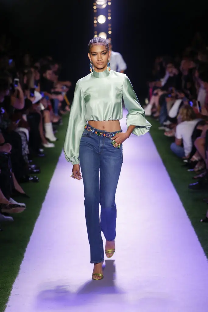 Brandon Maxwell denim jeans with Kenneth Jay Lane jeweled belt, pale green satin cropped blouse. (Photo courtesy of Brandon Maxwell)