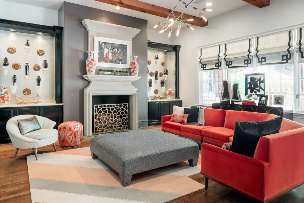 The living room features a stately fireplace. 