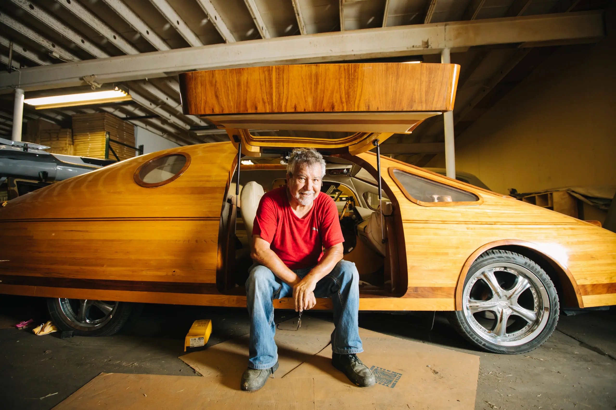 Isaac Cohen with his amazing wooden art car