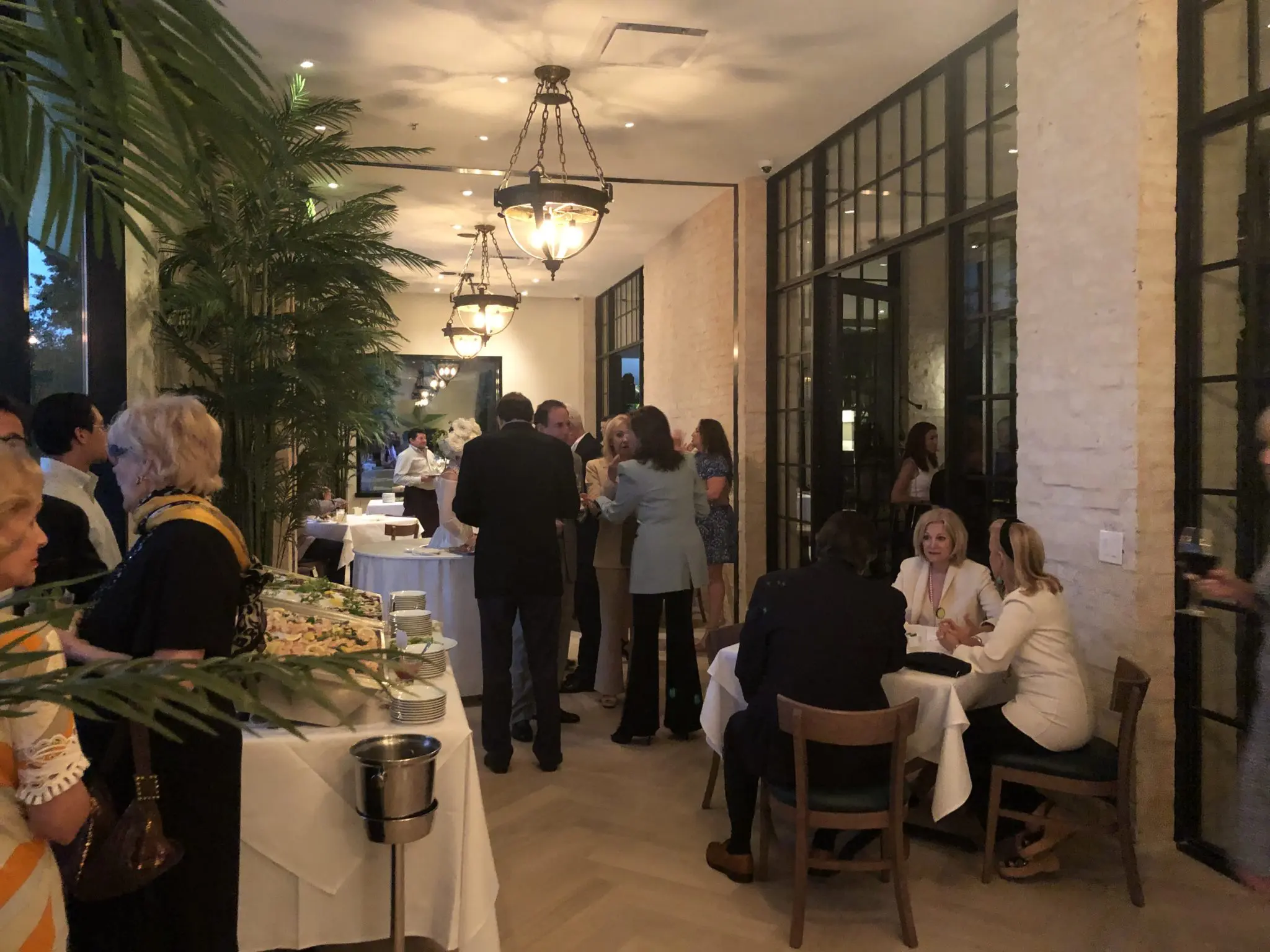 Rustic white-washed brick and white wooden floors brighten the former Café Annie space. Just call it The Annie. (Photo by Shelby Hodge)