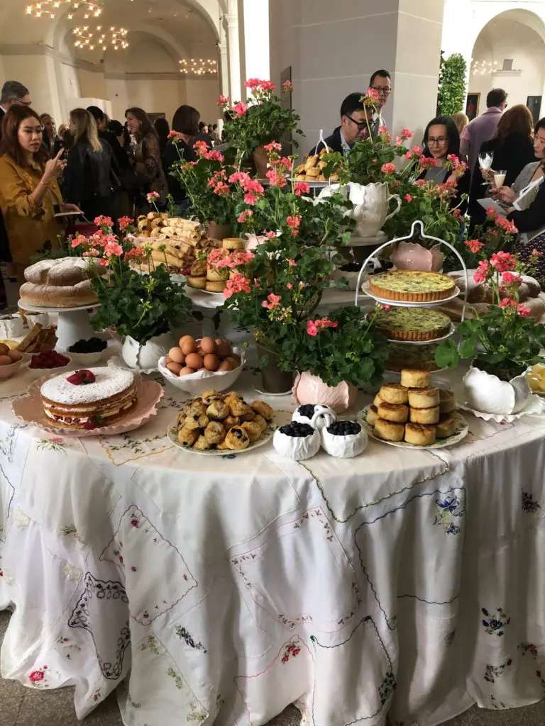 Tory Burch turned the Beaux-Arts Court at the Brooklyn Museum into an English country garden/high tea scene, with tables laden with scones and other delicacies. (Photo by Clifford Pugh)