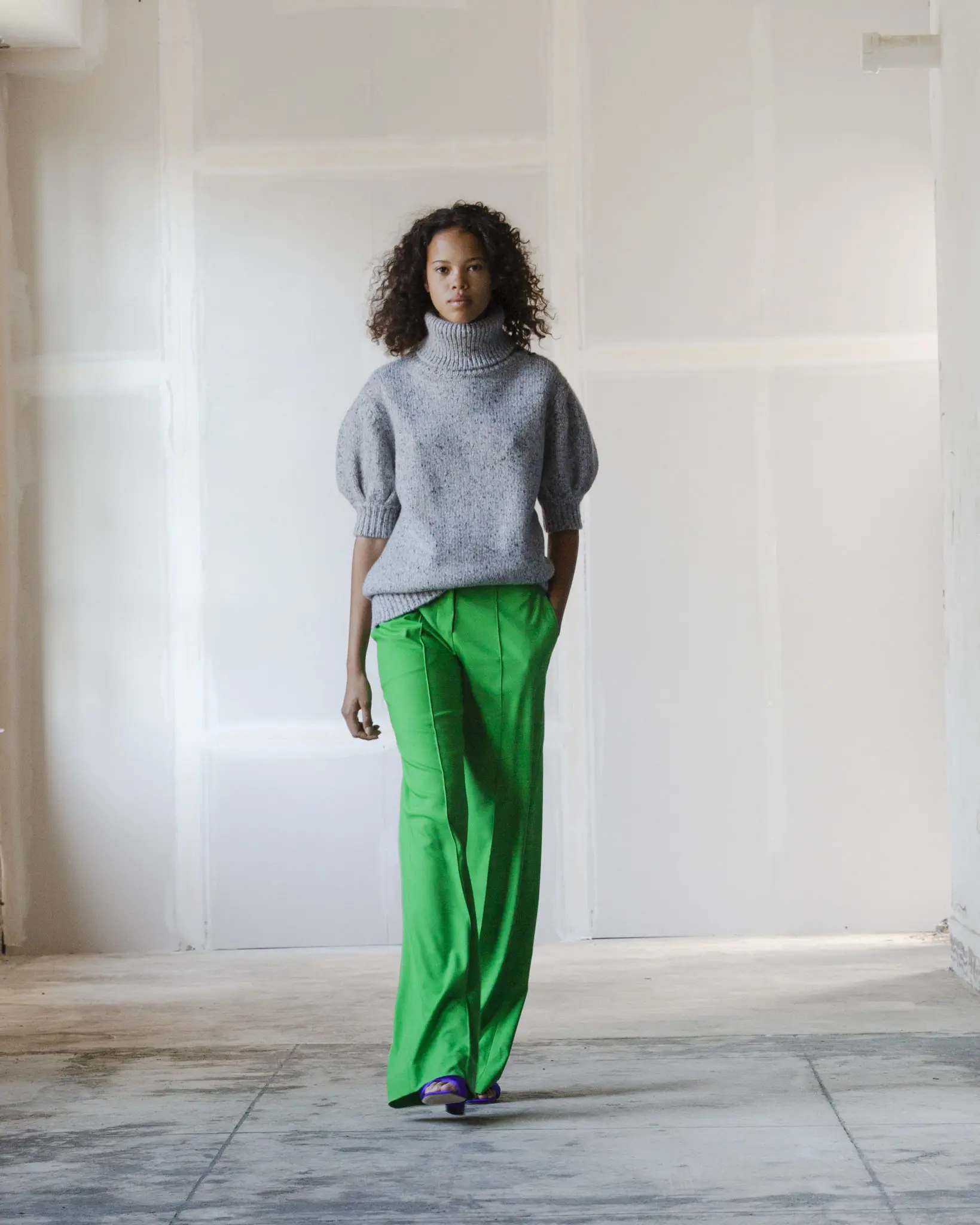 Adam Lippes heather grey marled cashmere knit sweater, green wool pant, purple satin ankle tie heel. (Photo courtesy of Adam Lippes)