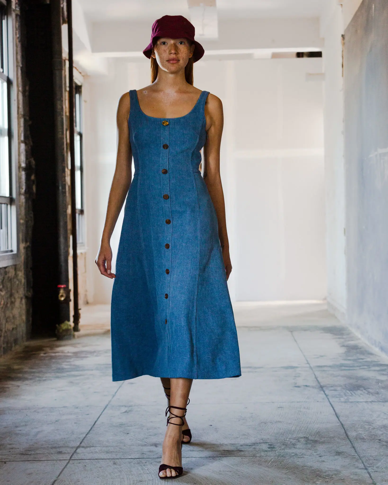 Adam Lippes sun-bleached light denim dress, burgundy suede ankle tie-told heel. (Photo courtesy of Adam Lippes)