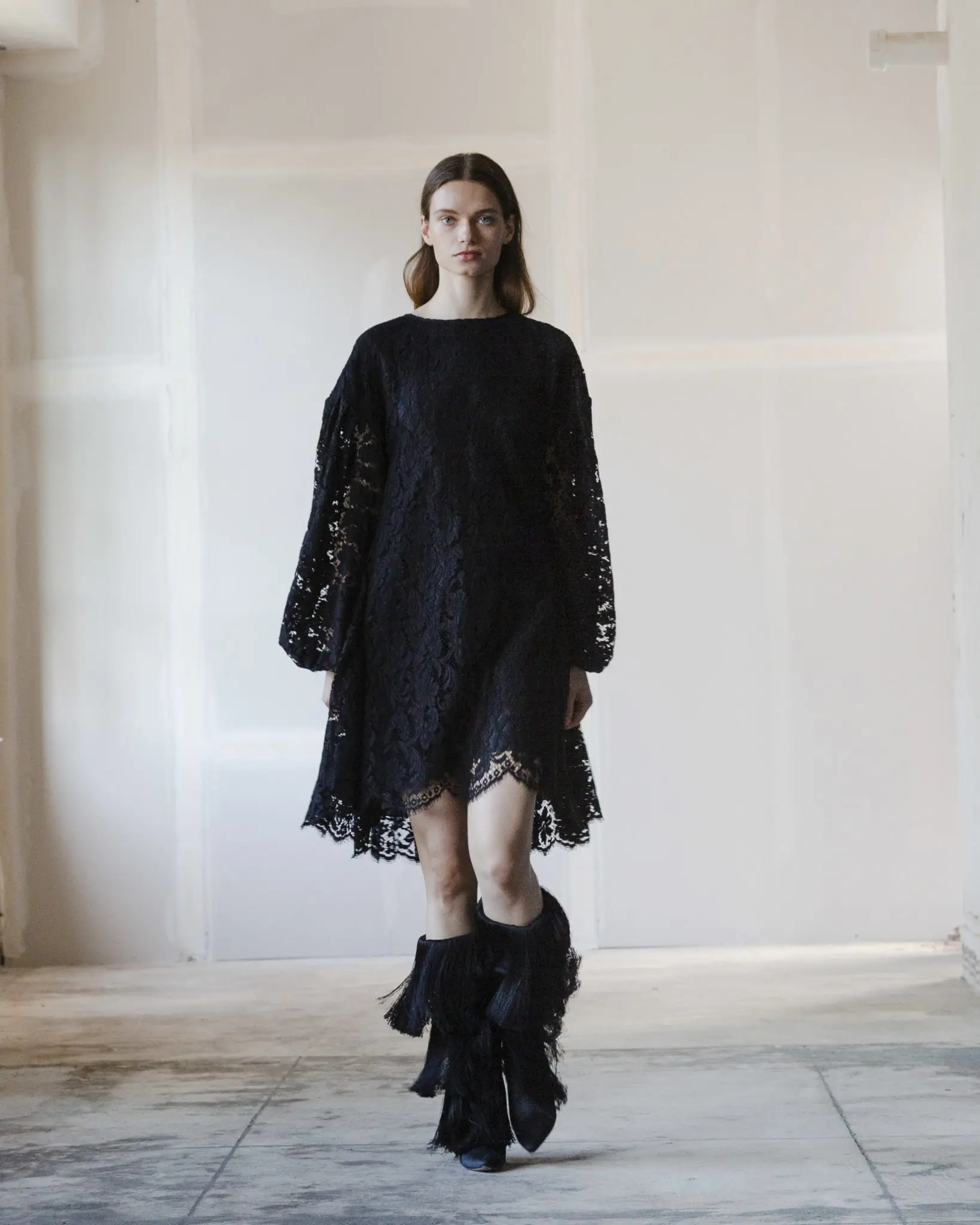 Adam Lippes black Guipure lace dress, black silk fringe boot. (Photo courtesy of Adam Lippes)