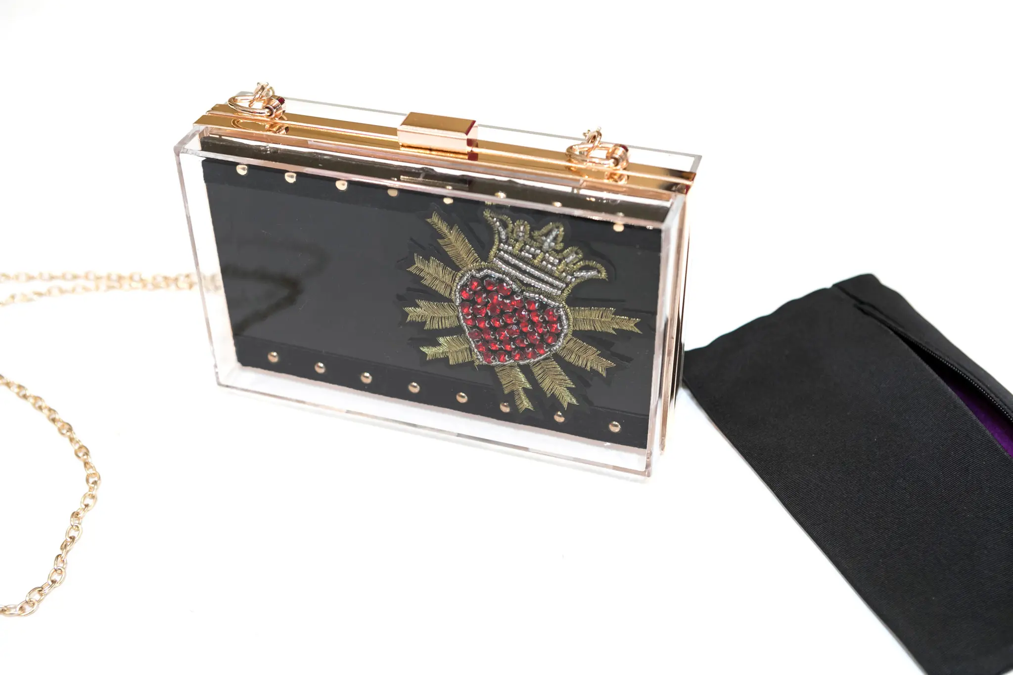 For La Favorite, the clear acrylic clutch with a crystal heart achieves Peck’s desire for a gothic feel.