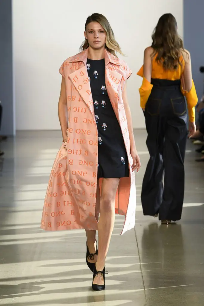 Bibhu Mohapatra sends a subtle message of empowerment with a silk jacquard coat embossed with the phrase, "B The One" worn over a crystal medallion embroidered denim dress. (Photo courtesy of Bibhu Mohapatra)