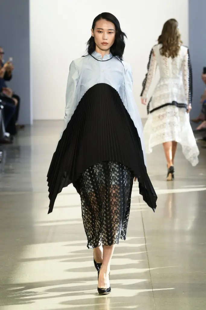 Bibhu Mohapatra sky cotton tunic shirt under black vine guipure skirt and pleated tulle and cotton cardigan. (Photo courtesy of Bibhu Mohapatra)