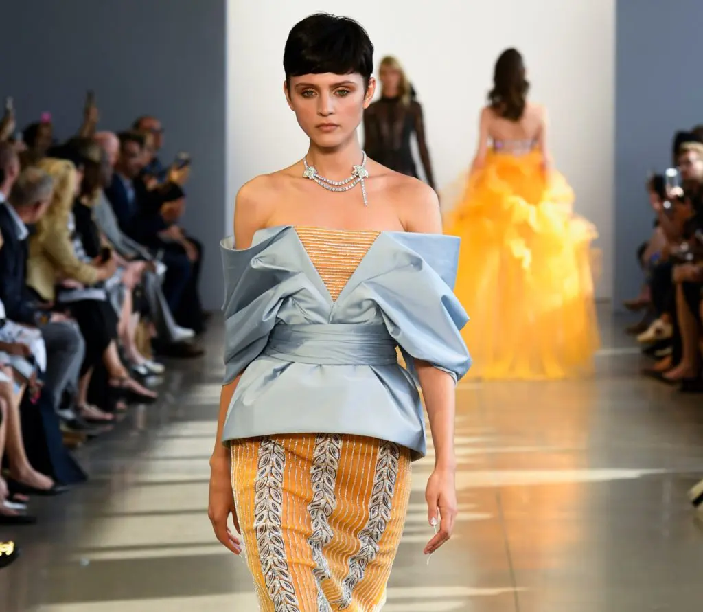 Bibhu Mohapatra mango pinstripe embroidered strapless gown with powder blue draped jacket. (Photo courtesy of Bibhu Mohapatra)