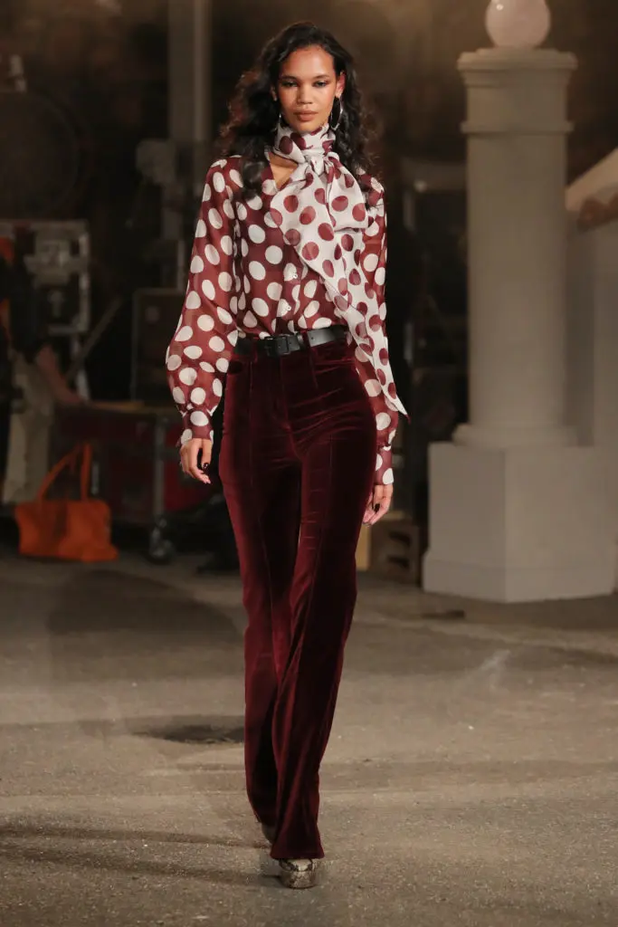 Tommy X Zendaya polka dot organza blouse, velvet spot plunge bra, velvet bootleg pants. (Photo courtesy of Tommy HIlfiger)