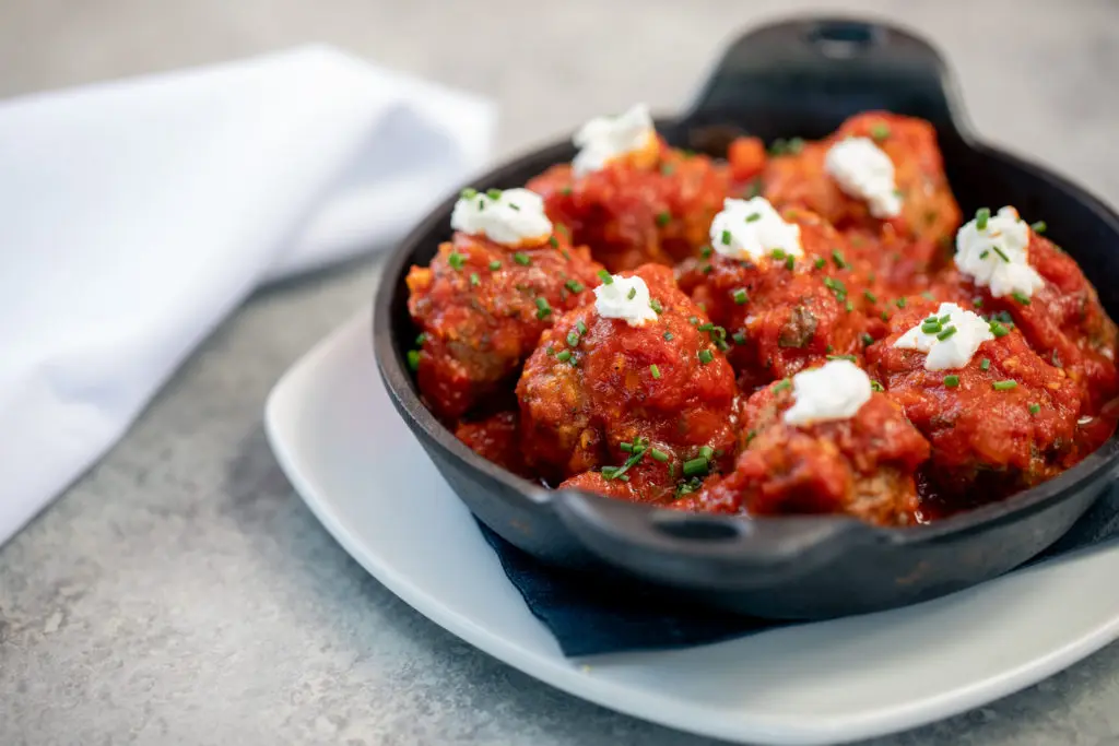 Postino's menu includes a meatballs and goat cheese dish.