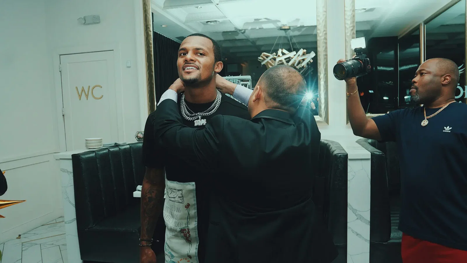 DeShaun dons the $25,000 necklace diamond and platinum necklace, a gift from friend J Mulan and Tequila Avión.