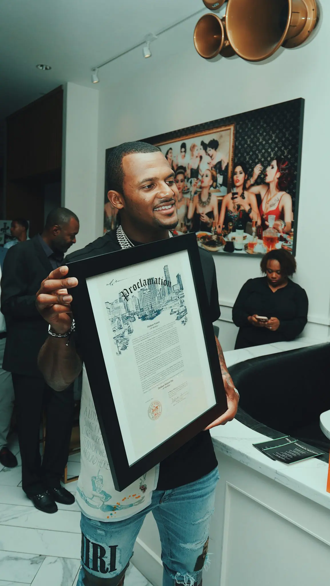 Houston Texans quarterback DeShaun Watson shows off his Mayoral Proclamation declaring it DeShaun Watson day in Houston.