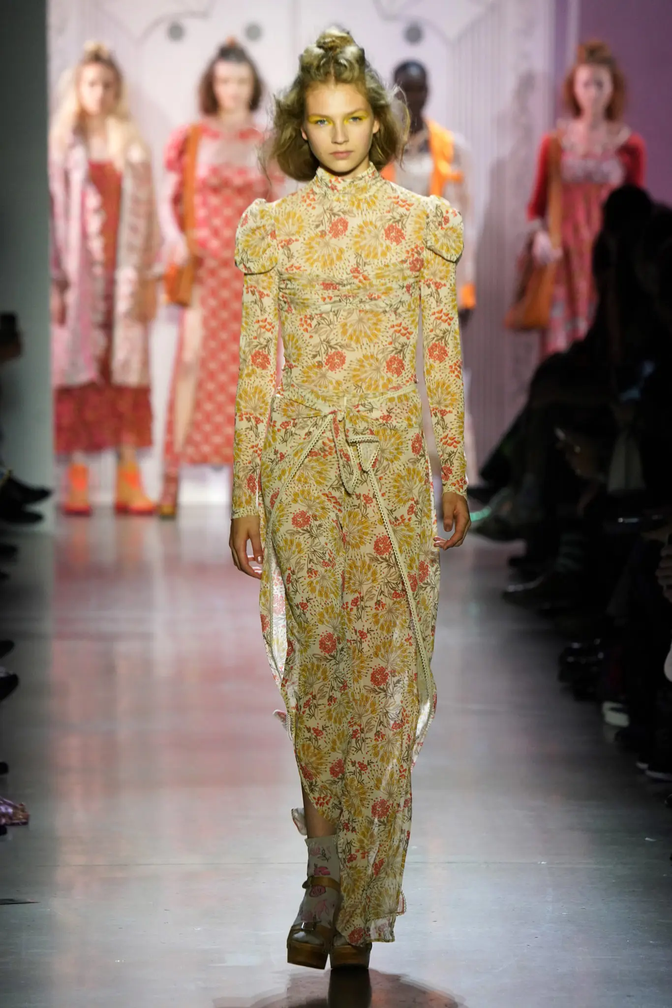 Anna Sui led off her spring 2020 collection with a coral long-sleeve multi-firework mesh top and pants. (Photo by Thomas Lau courtesy of Anna Sui Design Studio)