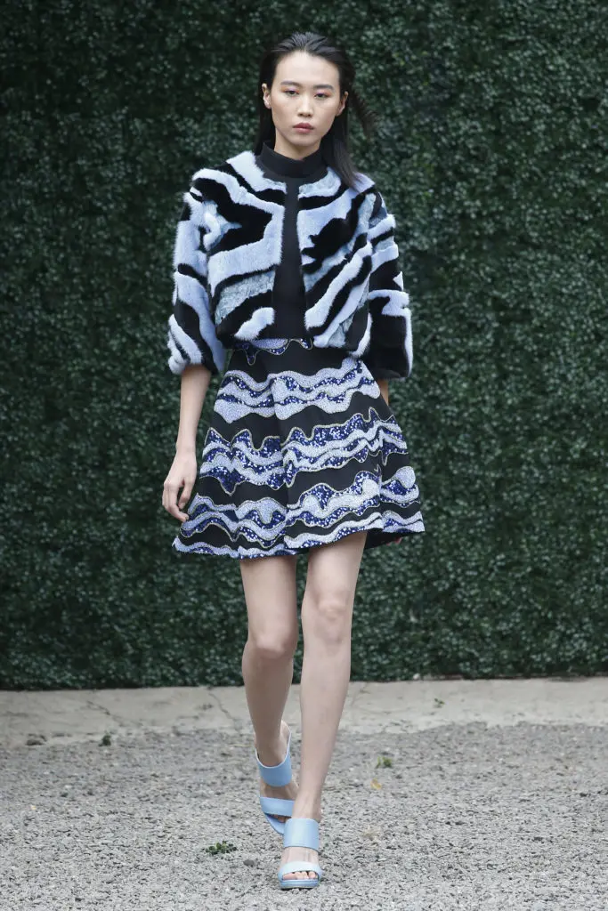 Burnett New York black high neck top with black multi-wave skirt and crop fur jacket. (Photo courtesy of Burnett New York)