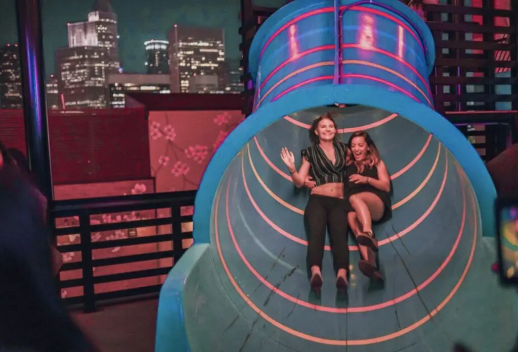 Midtown’s Newest Bar Brings a Giant Indoor Slide — and a Reverence for All Things ’90s