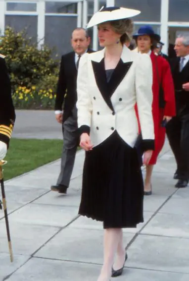 In 1985, Princess Diana wore a white double-breasted jacket trimmed in black designed by Bruce Oldfield. (Pinterest)