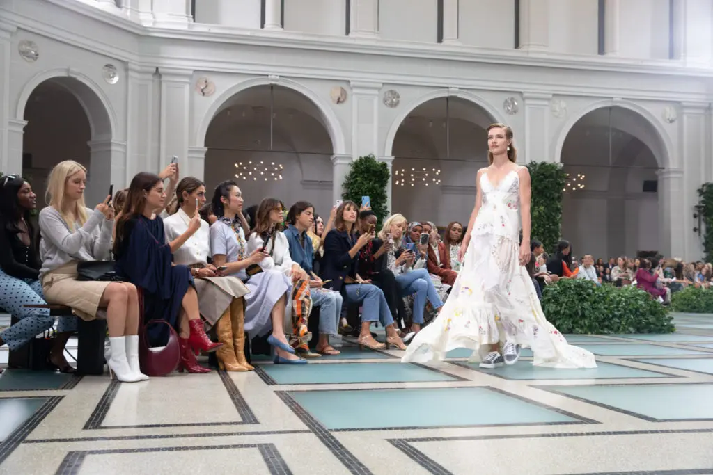 Model and humanitarian Natalia Vodianova led off the Tory Burch spring 2020 runway show in a handkerchief-intarsia cotton-silk organdy and crepe de chine maxi-skirt and camisole top, plus sneakers. (Photo courtesy of Tory Burch)
 