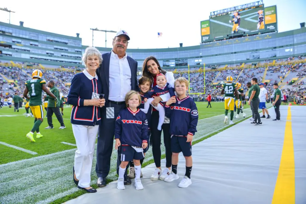 Janice McNair enjoys a sideline moment with Cal and Hannah McNair and her grandkids . (Photo by Michelle Waston, catchlightgroup.com)