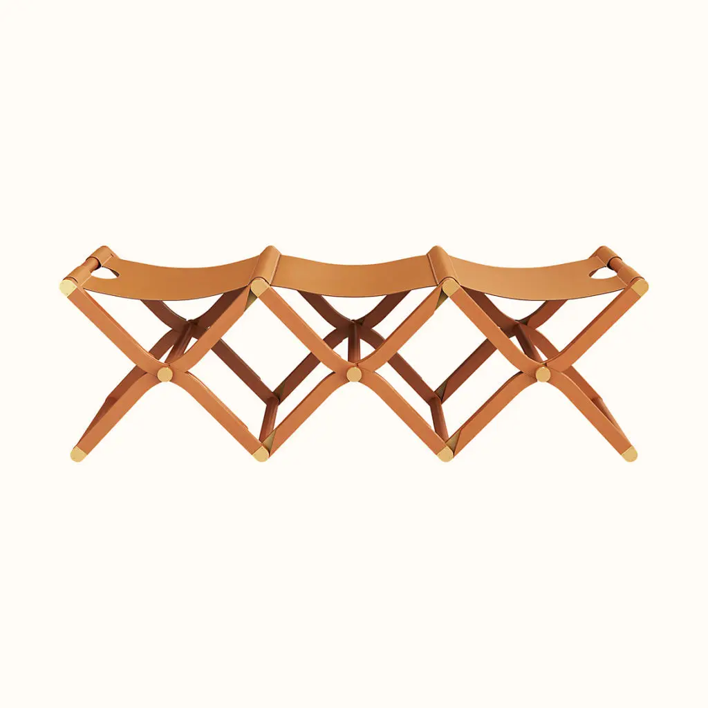 Every piece of furniture, from this three-seater bench to an oxblood daybed, is glamorous. 