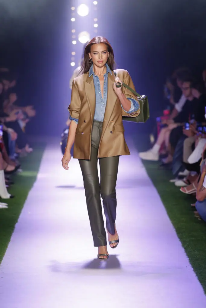 Brandon Maxwell set a casual tone for his spring 2020 collection by opening with a brown double-breasted blazer, denim shirt, tight green leather slacks, and strappy sandals. (Photo courtesy of Brandon Maxwell)