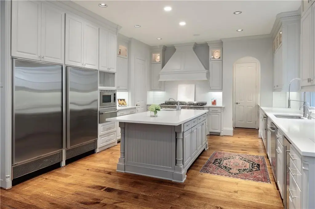 The comely kitchen is completely renovated. 