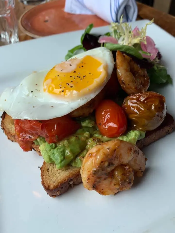Shrimp Toast at Rapscallion comes with Multigrain Bread, Sautéed Gulf Shrimp, Confit Tomato, Avocado, Sunny Egg. (Courtesy of Rapscallion)