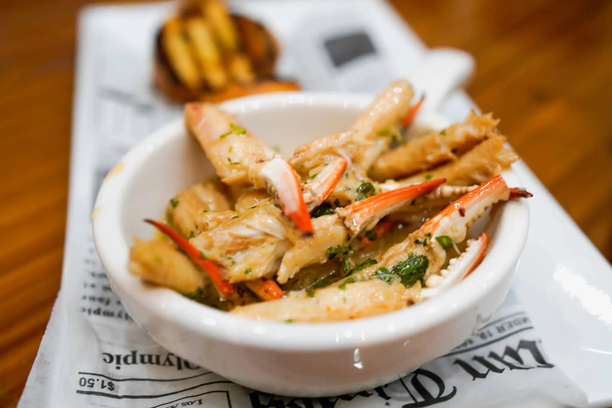 The favorite at Crab House Seafood & Oyster Bar is the Crab Claws in Garlic Butter. Courtesy of Crab House