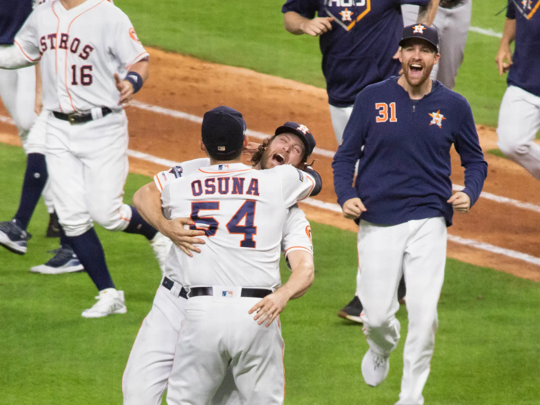 Gerrit Cole wrapped closer Roberto Osuna in the bear hug of bear hugs after the ALDS win over Tampa Bay. (Photo by F. Carter Smith)